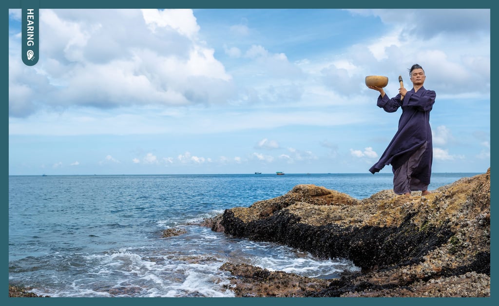 Tsang Man-tung performs to the rhythm of the waves.