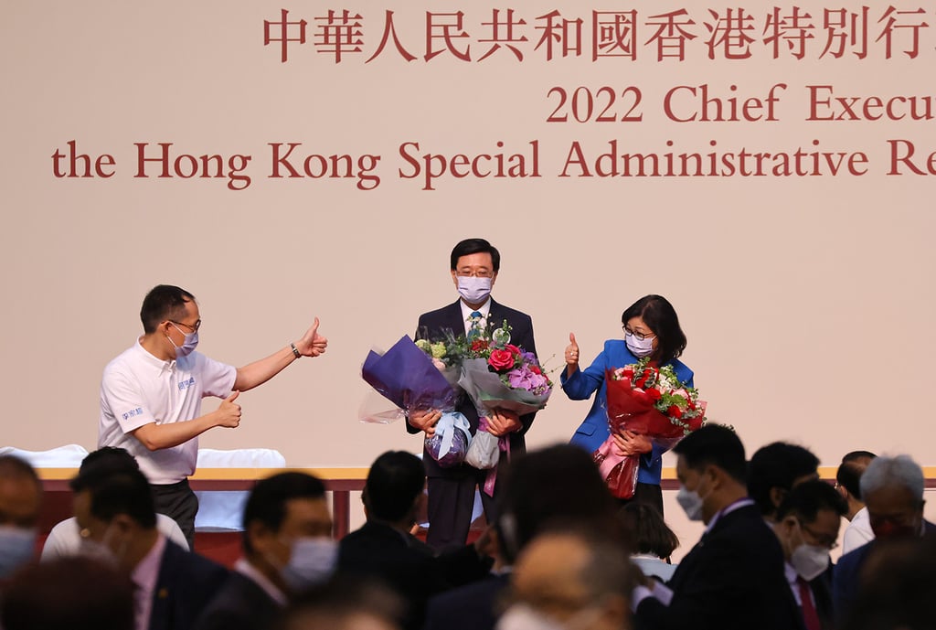Chief Executive-elect John Lee and his wife Janet Lam celebrate his win. Photo: Nora Tam