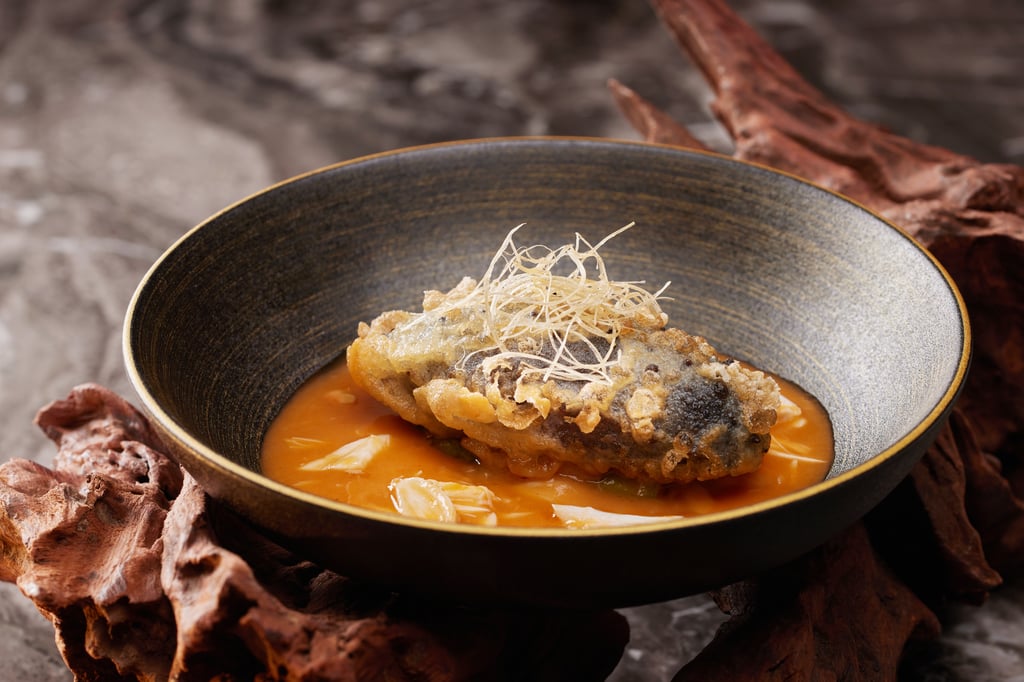 Featured on the Tasting Gourmet Menu, the crispy Japanese sea cucumber stuffed with minced pork and shrimp is a masterstroke that transforms an acquired taste into a dish of universal appeal.