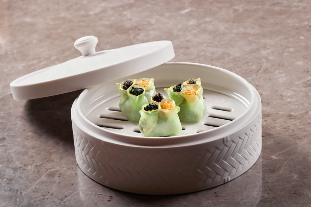 Visually pleasing and irresistibly mouth-watering, the steamed crab meat dumpling with black truffle and vegetables is a true delicacy.