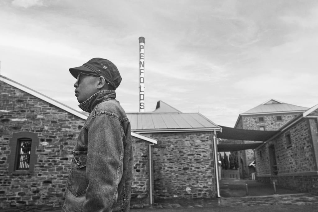 NIGO at Penfolds Magill Estate, where the historic red and white chimney inspired his design for Penfolds 65F by NIGO.