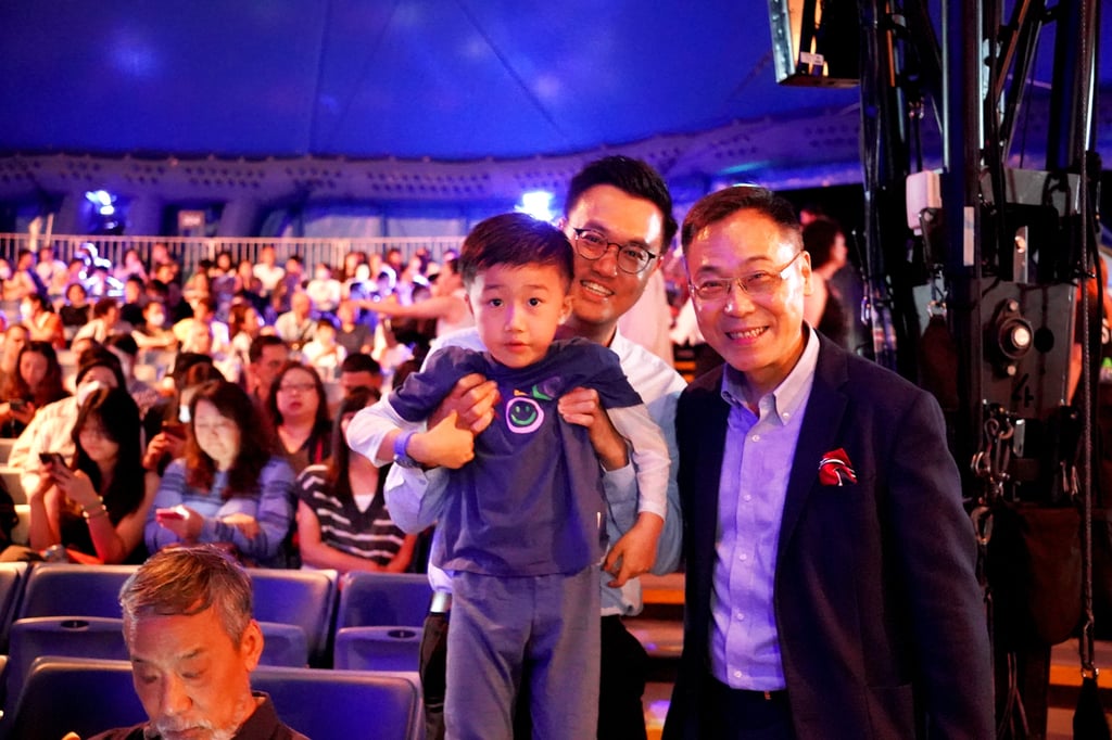 Mr Vincent Lam shares the joy with recipients of the donated tickets.