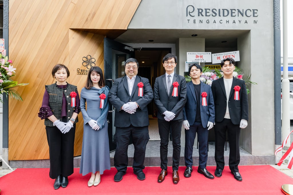 Roy Yip (centre) cuts the ribbon at the opening of R Residence Tengachaya IV in Osaka, unveiling the group’s newest serviced‑apartment property. Roy Yip (centre) cuts the ribbon at the opening of R Residence Tengachaya IV in Osaka, unveiling the group’s newest serviced‑apartment property.