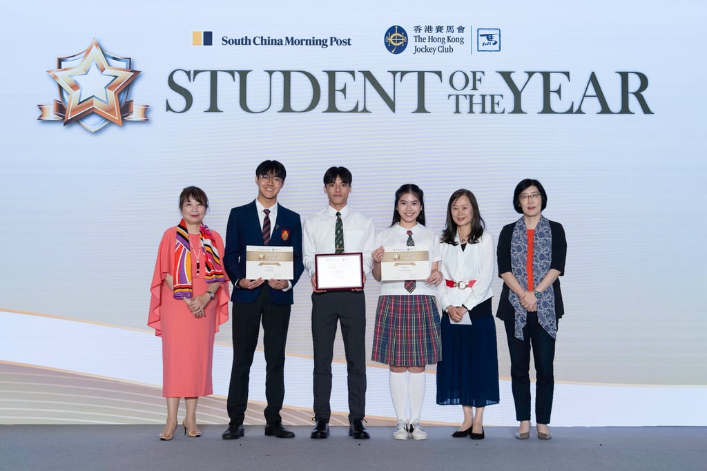 Student of the Year Awards 2025/26 Grand Prize winner Jayden Tang (third from the left); first runner-up Tam Ho Wang (second from the left); and second runner-up Choi Hai Tung Hazel (third from the right), receive their awards on stage from Irene Chan, Head of Public Affairs (Corporate & Charities Communications) of The Hong Kong Jockey Club (first from the left); Tammy Tam, Publisher of the South China Morning Post (second from the right); Hsu Siu-man, Executive Director of The Hong Kong Federation of Youth Groups (first from the right).