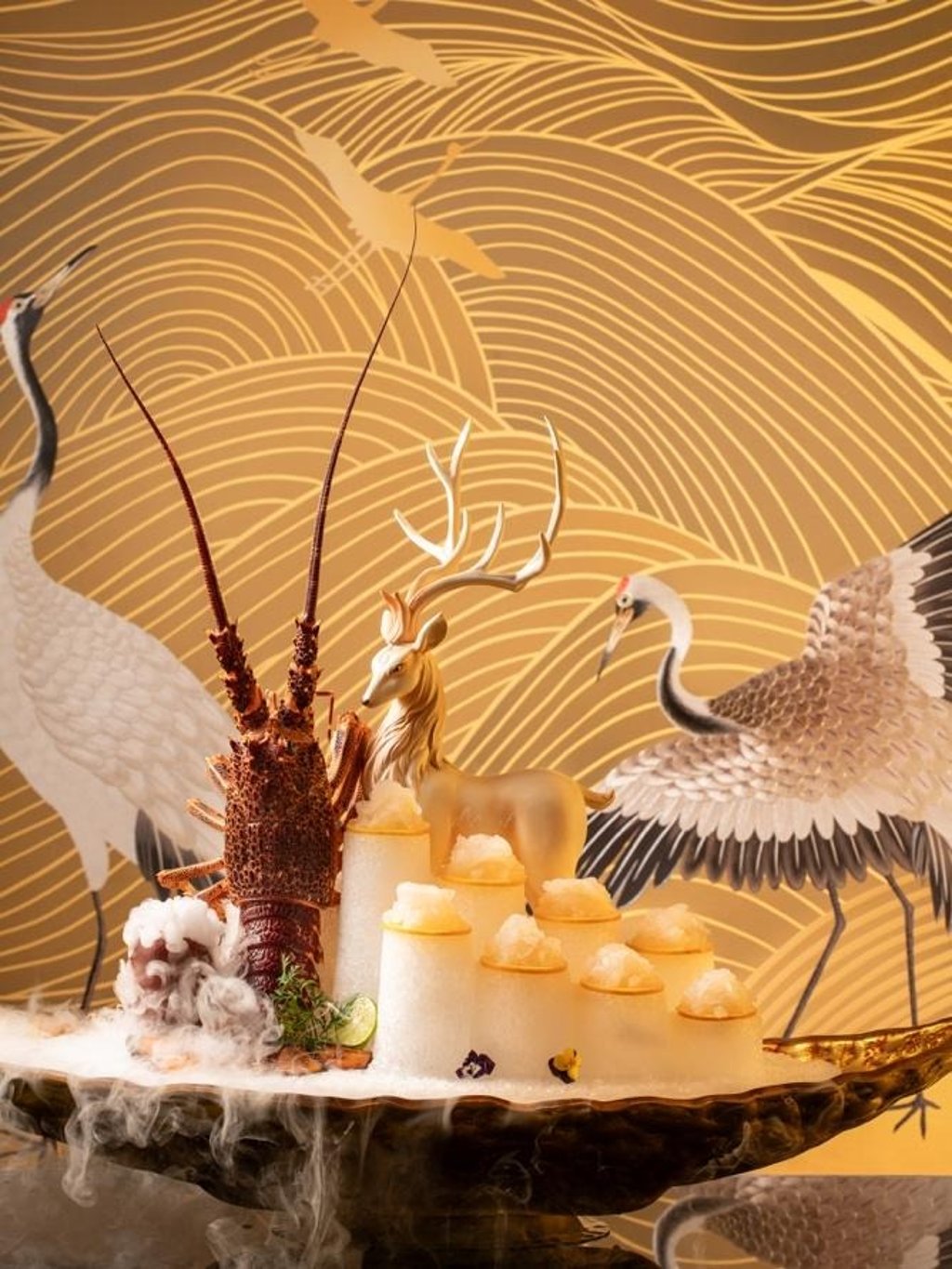 Crane motifs rendered in handcrafted Suzhou embroidery bring artistry and symbolism to Enchanté’s interiors.