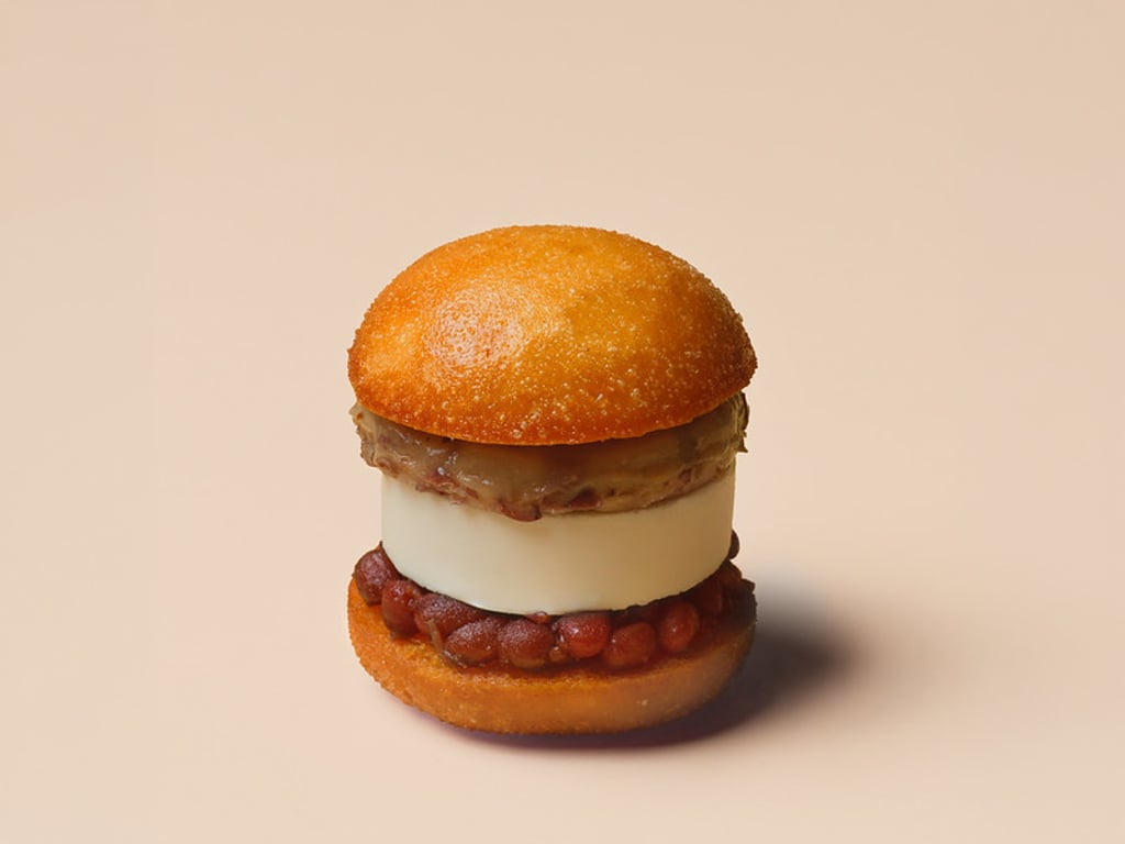 The “Put Chai Ko” Ice Cream Bao gives the nostalgic Hong Kong street snack a playful twist with chenpi-glazed red beans, salted ice cream and handmade mochi. The “Put Chai Ko” Ice Cream Bao gives the nostalgic Hong Kong street snack a playful twist with chenpi-glazed red beans, salted ice cream and handmade mochi.