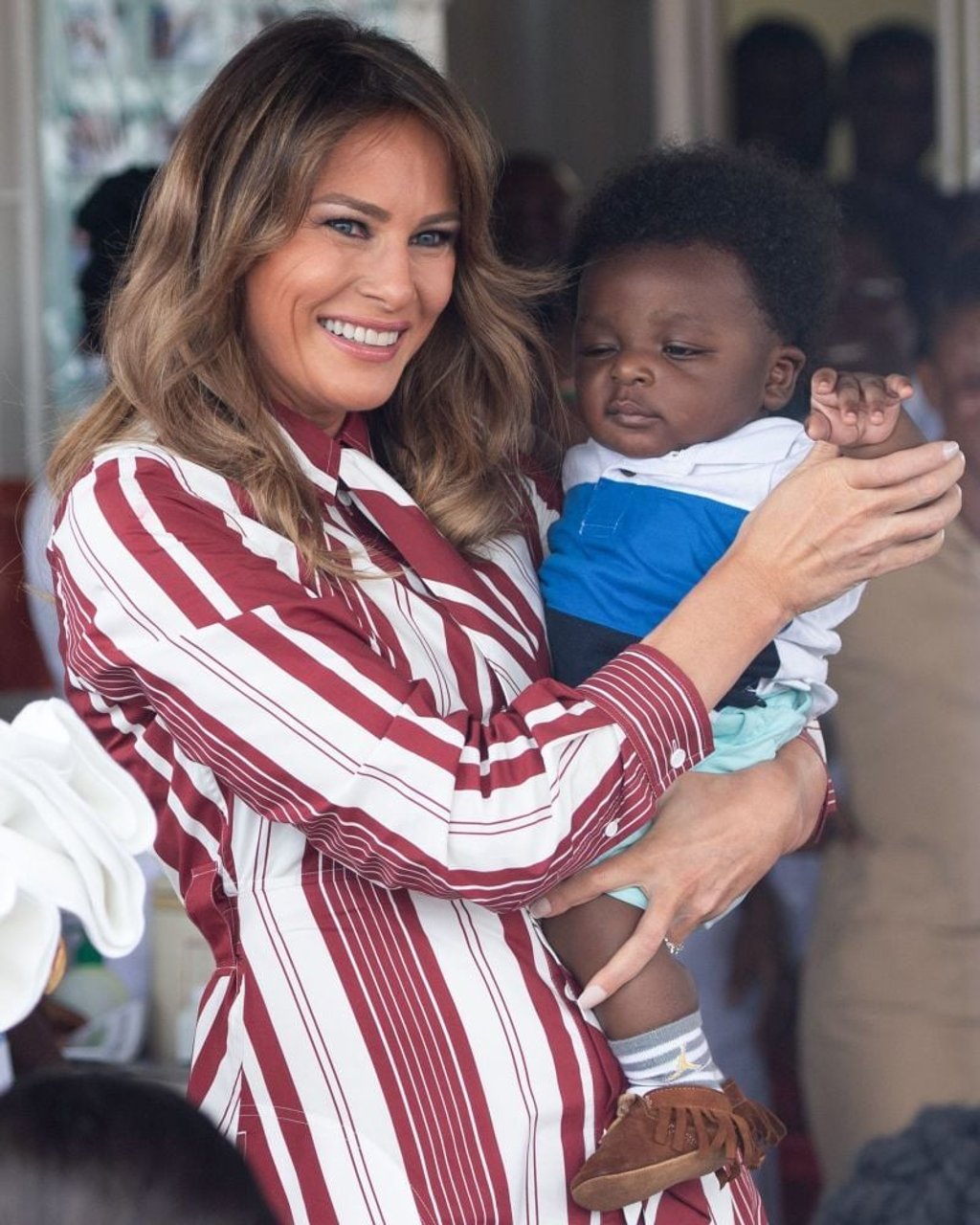 Melania Trump holds a baby during a visit to the Greater Accra Regional Hospital in Accra, on October 2, 2018, during a week-long trip in Africa to promote her Be Best campaign. Photo: AFP