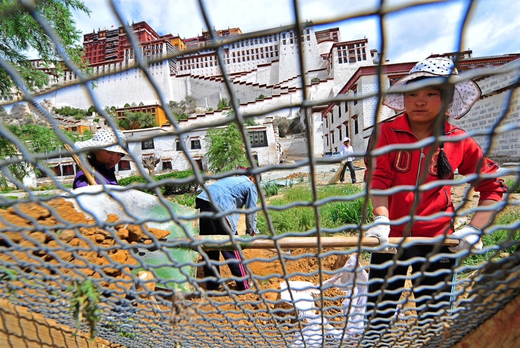 Tibetan women work at a construction site in Lhasa. China’s labour laws state that employment policies should not discriminate based on gender. Photo: AFP