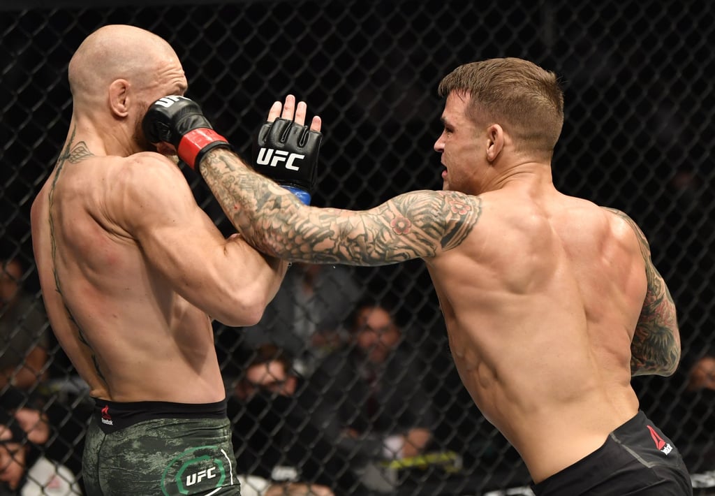 Dustin Poirier (R) punches Conor McGregor (L) in the lightweight fight during UFC 257 on January 23, 2021 in Abu Dhabi. Photo: Zuffa LLC