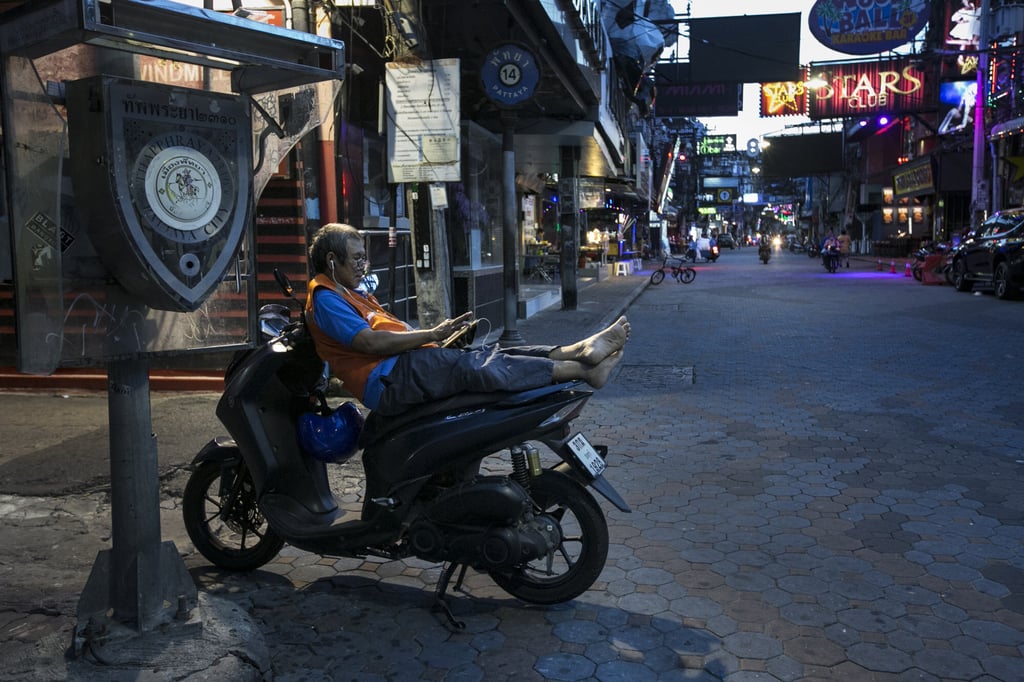A motorbike driver waits for customers in Pattaya, Thailand, on September 14, 2020. Photo: Getty Images A motorbike driver waits for customers in Pattaya, Thailand, on September 14, 2020. Photo: Getty Images