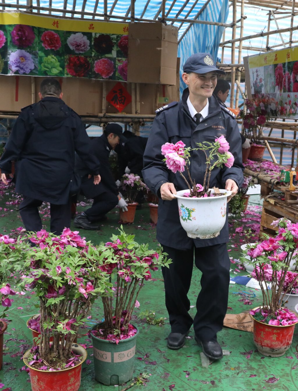Food and Environmental Hygiene Department workers clean up after the annual Lunar New Year flower fair at Victoria Park, on January 25. Photo: Dickson Lee Food and Environmental Hygiene Department workers clean up after the annual Lunar New Year flower fair at Victoria Park, on January 25. Photo: Dickson Lee