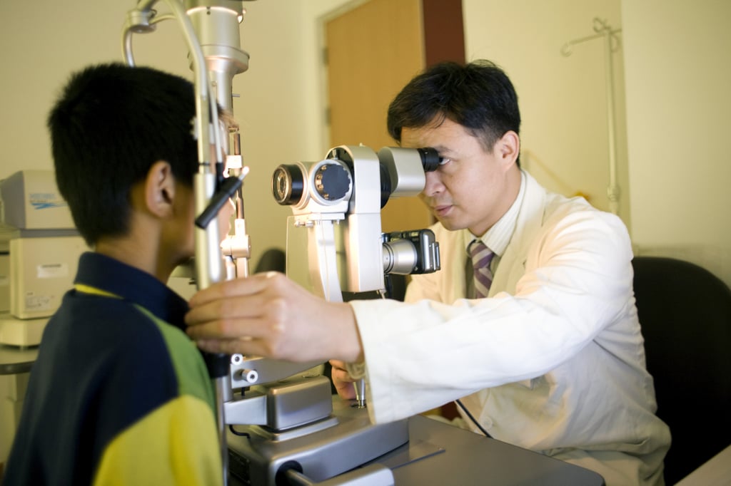 A doctor checks the eyes of a child in the BenQ Hospital in Nanjing, China. Photo: Corbis via Getty Images