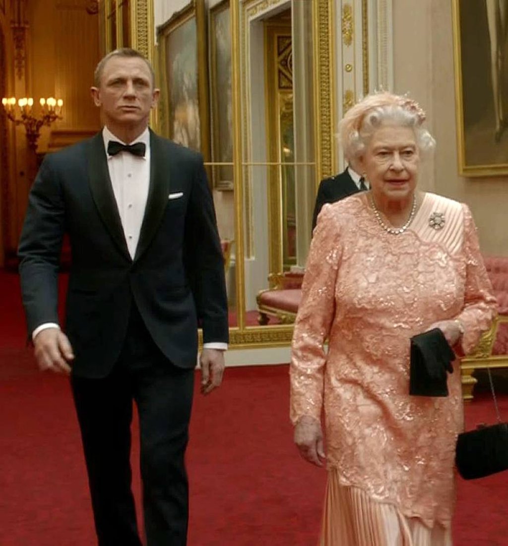 Footage featured during the opening ceremony of the London 2012 Olympic Games starring British actor Daniel Craig, playing James Bond, escorting Queen Elizabeth through the corridors of Buckingham Palace. Photo: AFP