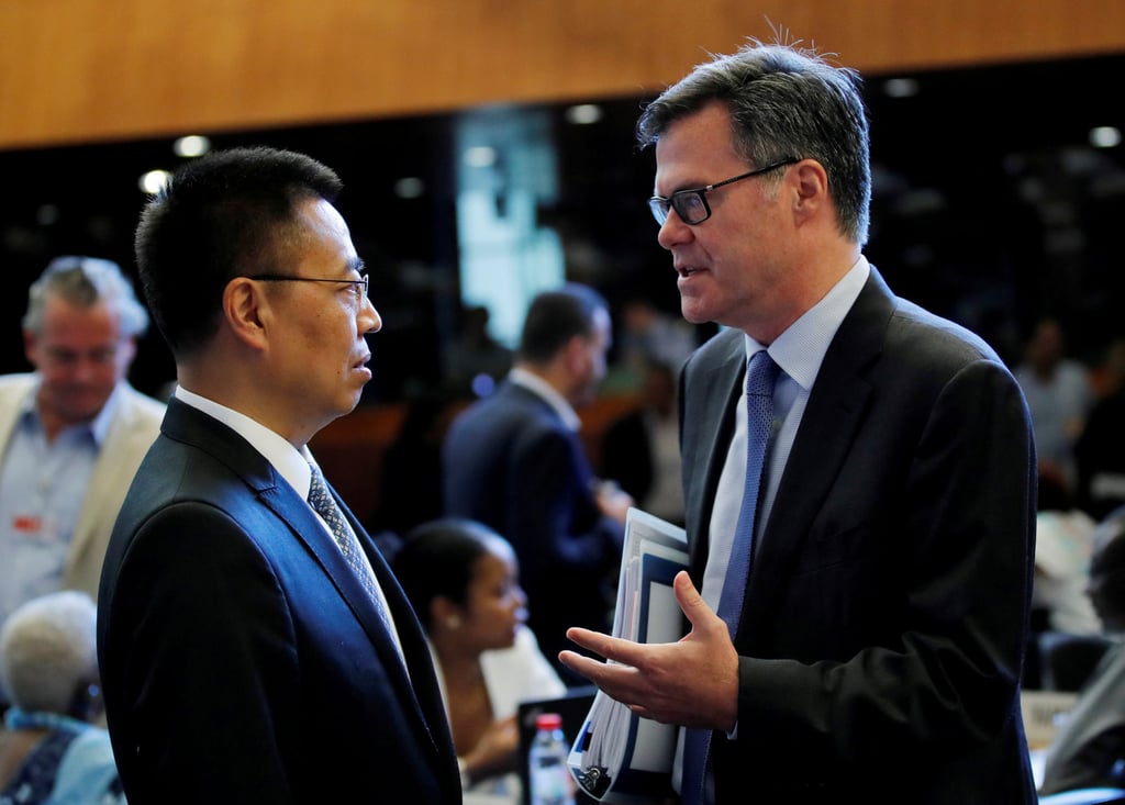 Dennis Shea (right), US ambassador to the World Trade Organization, talks with Zhang Xiangchen, then Chinese ambassador to the WTO, before the General Council meeting at the WTO in Geneva, Switzerland, on July 26, 2018. China, the US and the EU are frequent targets of trade disputes. Photo: Reuters
