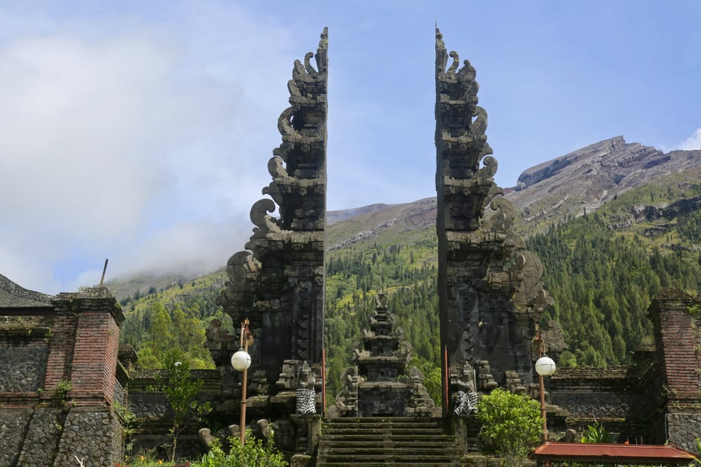 The trek up Mount Agung starts at Pasar Agung Temple. From here, it takes between four and five hours to climb to the highest point of the mountain that it’s currently possible to reach. Photo: Ian Neubauer The trek up Mount Agung starts at Pasar Agung Temple. From here, it takes between four and five hours to climb to the highest point of the mountain that it’s currently possible to reach. Photo: Ian Neubauer