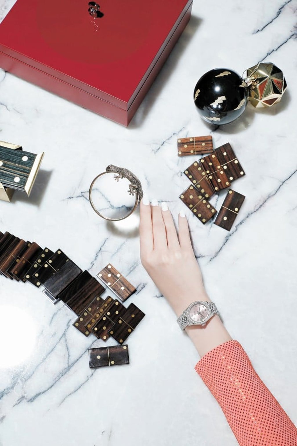 Rolex Datejust 31 in Oystersteel, white gold and diamonds, dress by Alexandre Vauthier at Net-a-Porter. Domino set and magnifier by L’Objet from Lane Crawford Home, Pacific Place, Hong Kong. Photo: SCMP