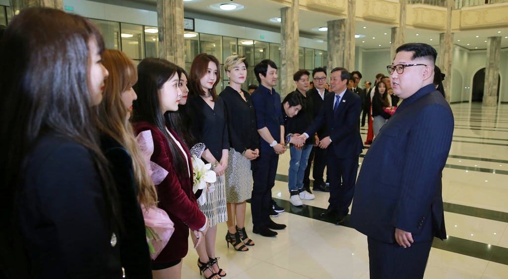 North Korean leader Kim Jong-un (right) talks to members of K-pop girl group Red Velvet at East Pyongyang Grand Theatre in Pyongyang in 2018. Photo: AP