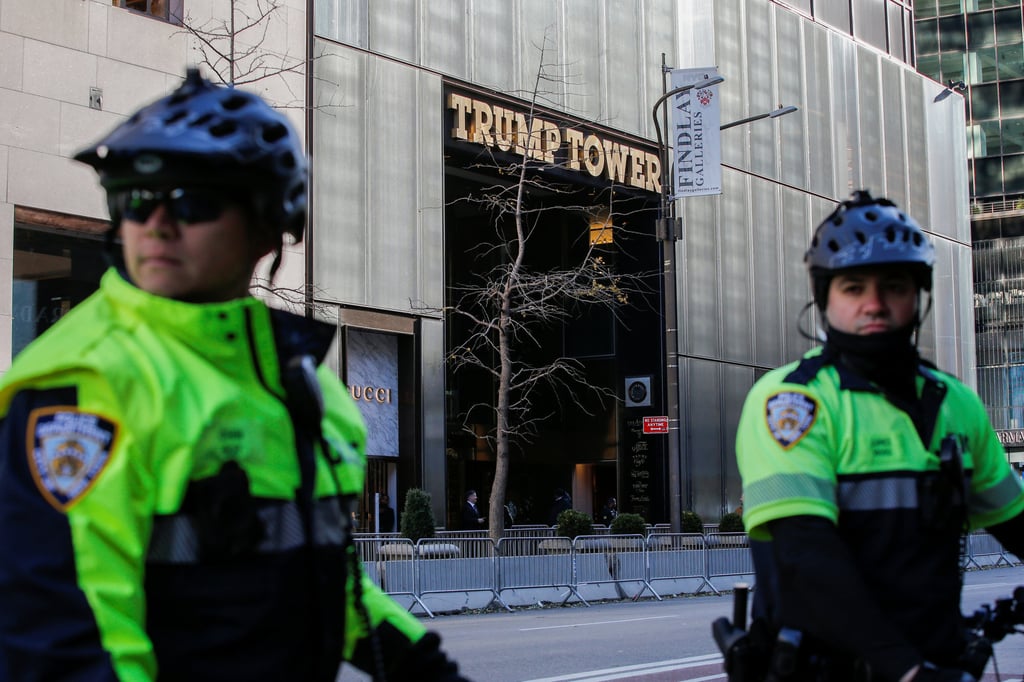 NYPD officers stand guard by their bicycles as demonstrators protest against then-president Donald Trump and government policies near Trump Tower in Manhattan, New York, in November 2019. Photo: Reuters NYPD officers stand guard by their bicycles as demonstrators protest against then-president Donald Trump and government policies near Trump Tower in Manhattan, New York, in November 2019. Photo: Reuters
