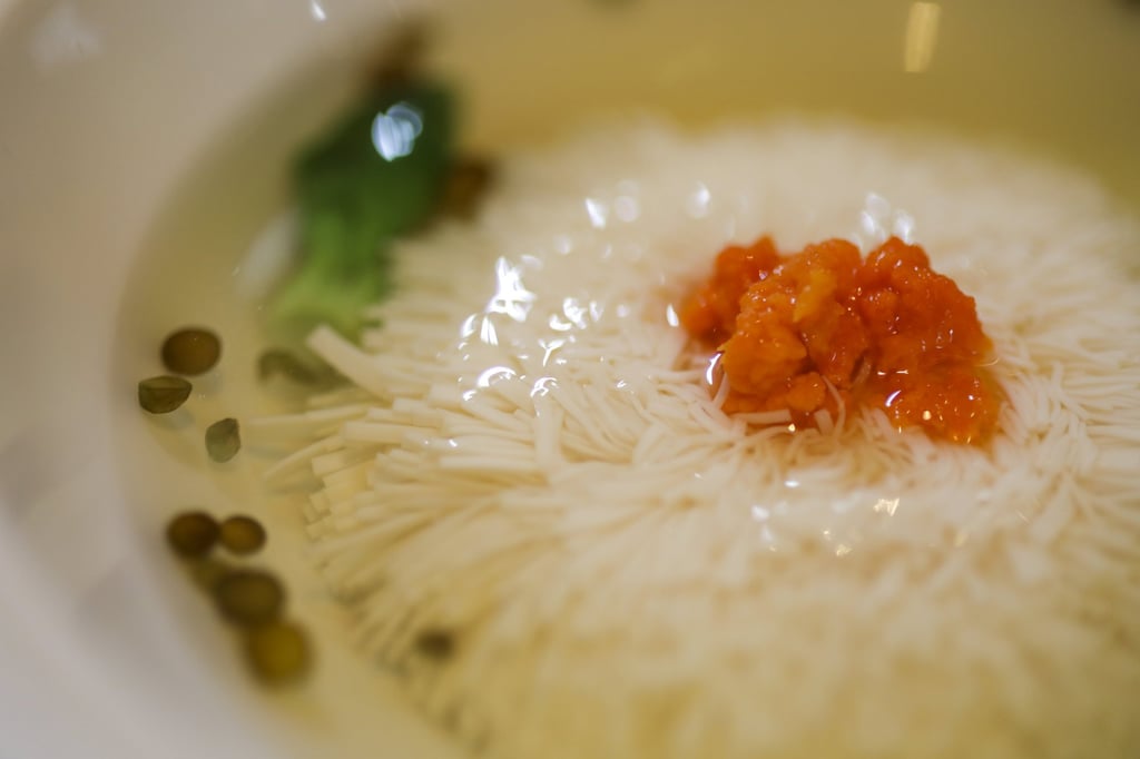 Chrysanthemum “thousand cut” silken tofu in chicken broth. Photo: Tory Ho