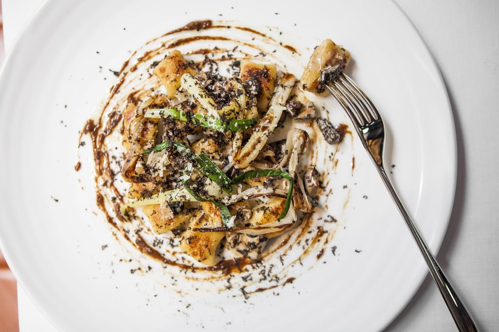 Sautéed potato gnocchi with shiitake ragout, charred leeks, Parmesan and fresh black truffle. Photo: handout