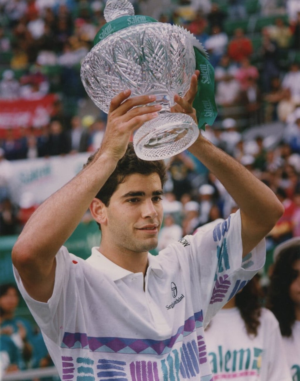 Pete Sampras holds the trophy after beating Jim Courier in the 1993 Salem Hong Kong Open final at Victoria Park. Photo: SCMP/MARTIN CHAN