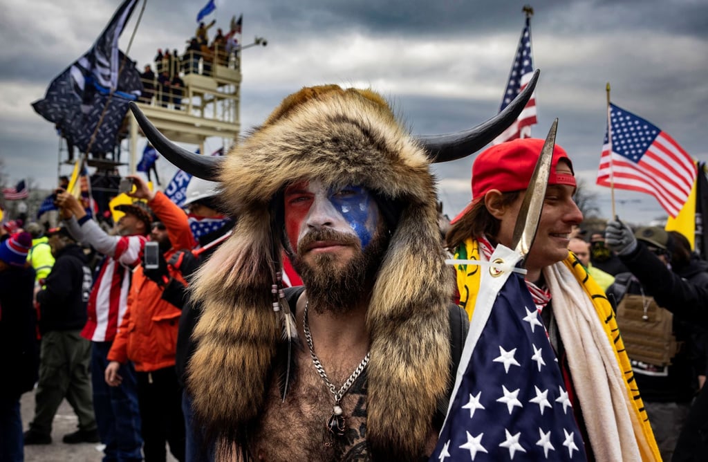 Jacob Anthony Angeli Chansley, known as the ‘QAnon Shaman’, is seen amid the insurrection at the US Capitol in January. Photo: Brent Stirton/Getty Images/TNS Jacob Anthony Angeli Chansley, known as the ‘QAnon Shaman’, is seen amid the insurrection at the US Capitol in January. Photo: Brent Stirton/Getty Images/TNS