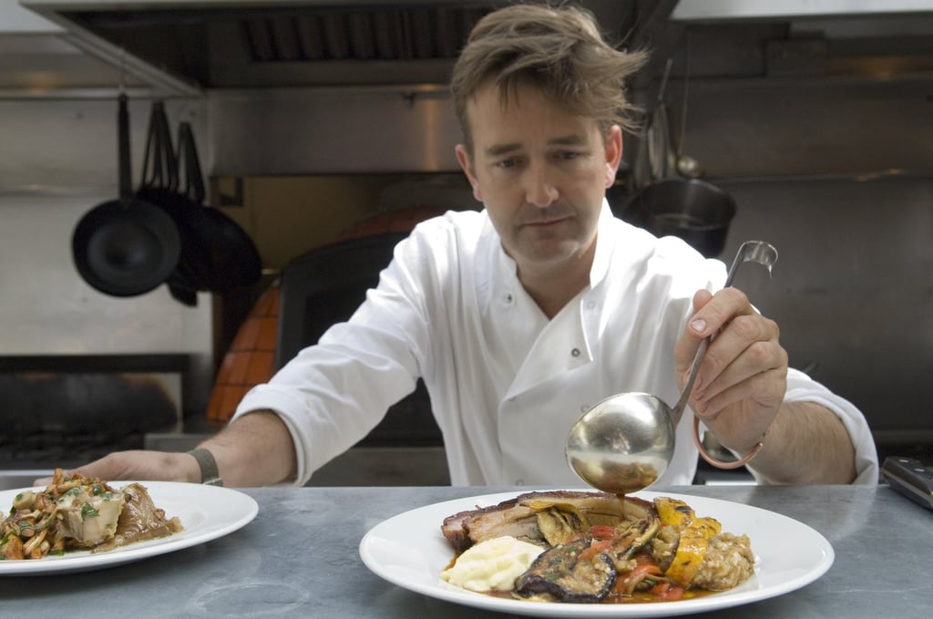 Samuel Clark prepares roast pork with escalibada and alioli at his Moro restaurant, in Exmouth Market, London. Photo: Getty Images