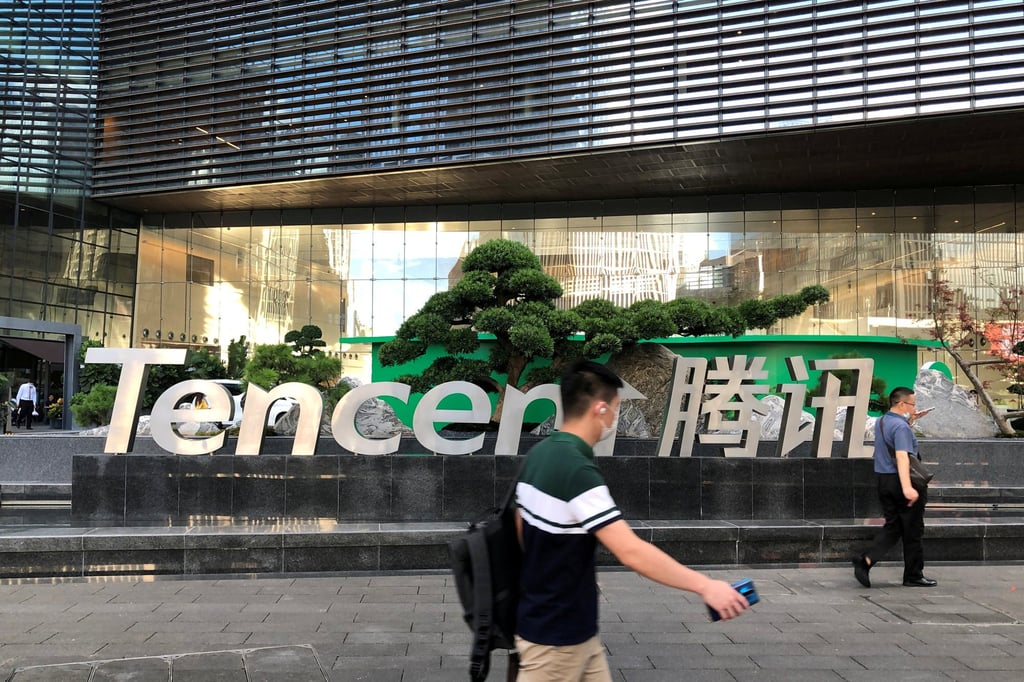 People walk past a Tencent sign at the company headquarters in Shenzhen, Guangdong province, China, on August 7, 2020. Photo: Reuters