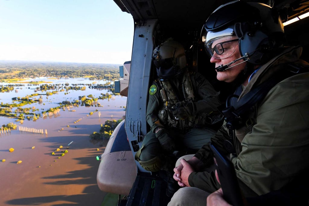Australian Prime Minister Scott Morrison inspects flood damages from an Australian Army helicopter during a visit to affected areas around Sydney on Wednesday. Photo: AFP