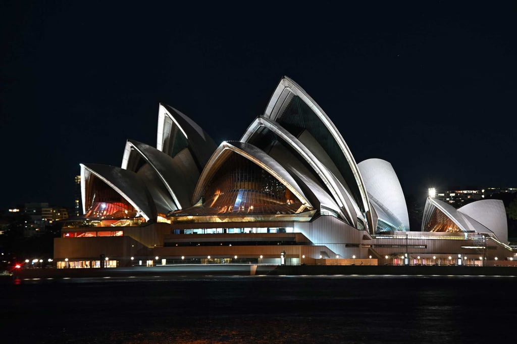 The Sydney Opera House is illuminated before Earth Hour on Saturday. Photo: AFP The Sydney Opera House is illuminated before Earth Hour on Saturday. Photo: AFP