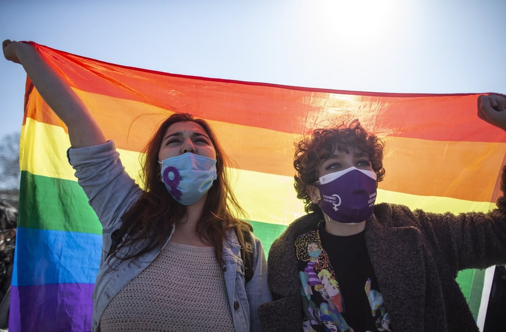 Women hold LGBTQI rainbow flags during a demonstration against Turkey’s decision to withdraw from the Istanbul Convention, in Istanbul, Turkey on Saturday. Photo: EPA-EF