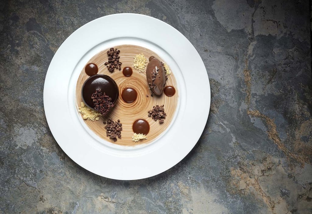 Chocolate bombe with salted caramel and hazelnut ice cream. Photo: handout