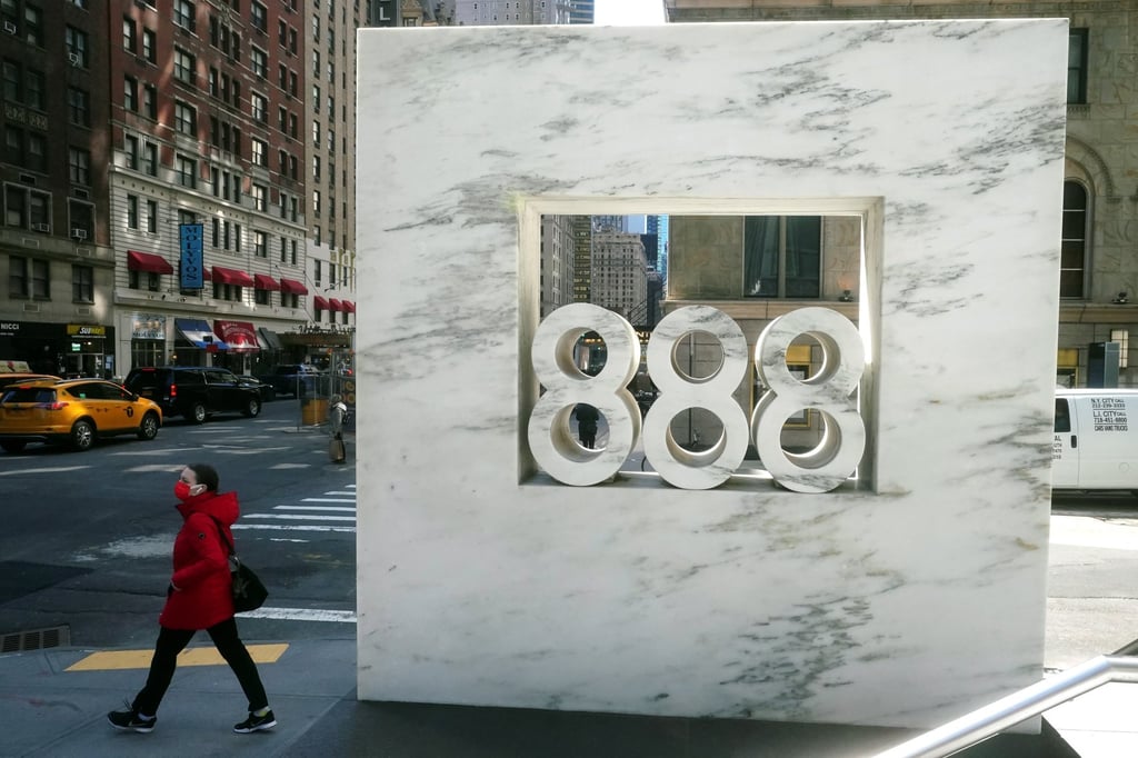 A person walks past 888 7th Ave, a building that reportedly houses Archegos Capital Management in the Manhattan borough of New York City. Photo: Reuters
