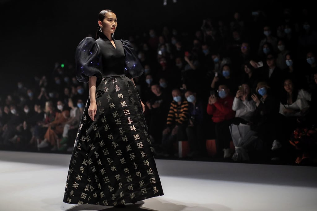 A model presents a creation by Zhou Li. The designer supports Chinese consumers boycotting Western apparel brands that have expressed concern over alleged rights abuses in Xinjiang. Photo: EPA-EFE