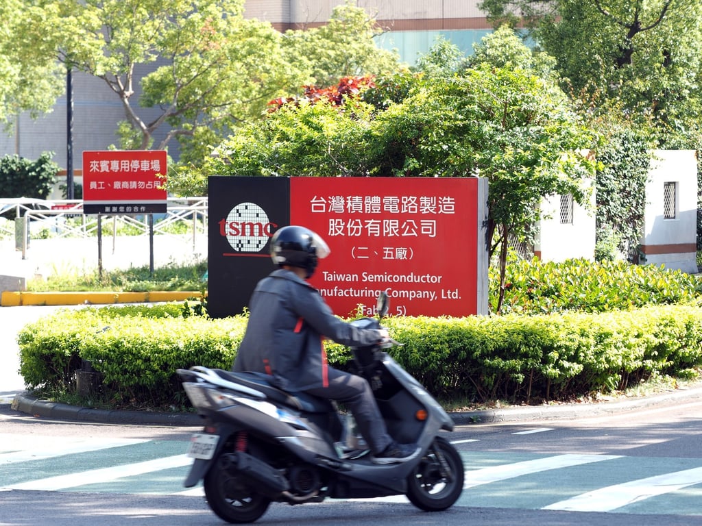 A biker passes a TSMC logo in Hsinchu, Taiwan, on 15 May 2020. Photo: EPA-EFE A biker passes a TSMC logo in Hsinchu, Taiwan, on 15 May 2020. Photo: EPA-EFE