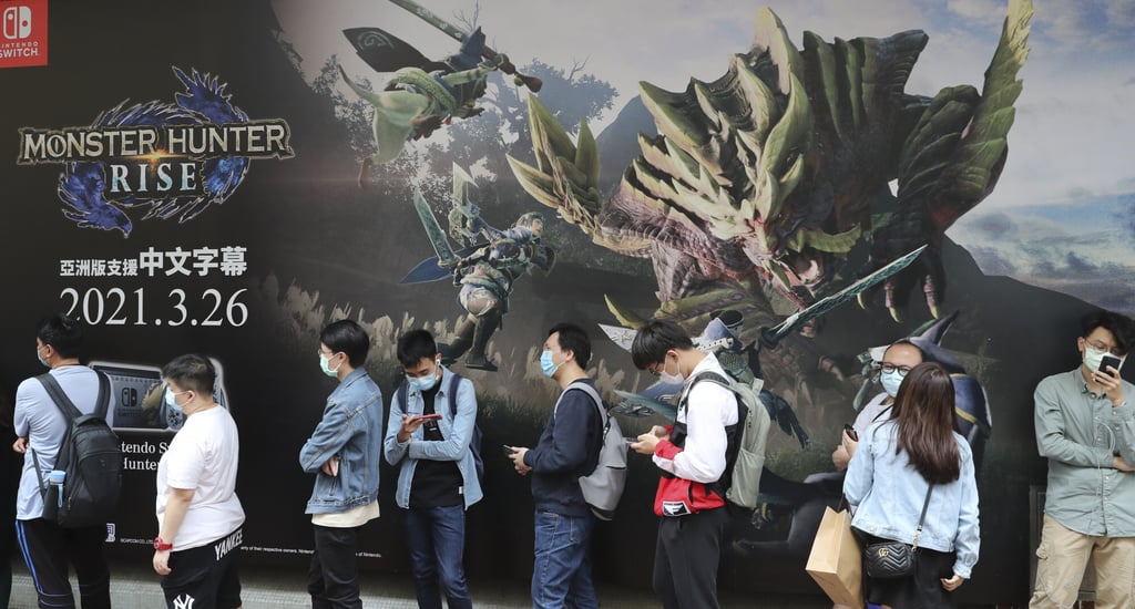 Buyers line up outside Golden Computer Arcade in Sham Shui Po on launch day for the Nintendo Switch game Monster Hunter Rise on March 26. While Hong Kong typically gets high-profile games at the same time as the rest of the world, mainland Chinese gamers are left waiting unless they resort to imported goods. Photo: Edmond So