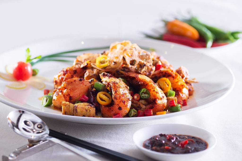 Wok-fried spicy prawns in chilli with dried bean curd and peanuts at Dong Lai Shun restaurant in the Royal Garden hotel, Tsim Sha Tsui East.