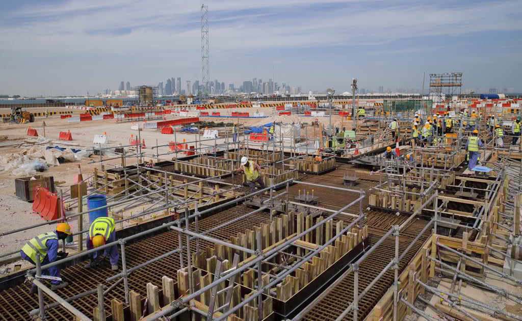 Construction workers at the site of the Ras Abu Aboud stadium in Doha, Qatar. Photo: AP