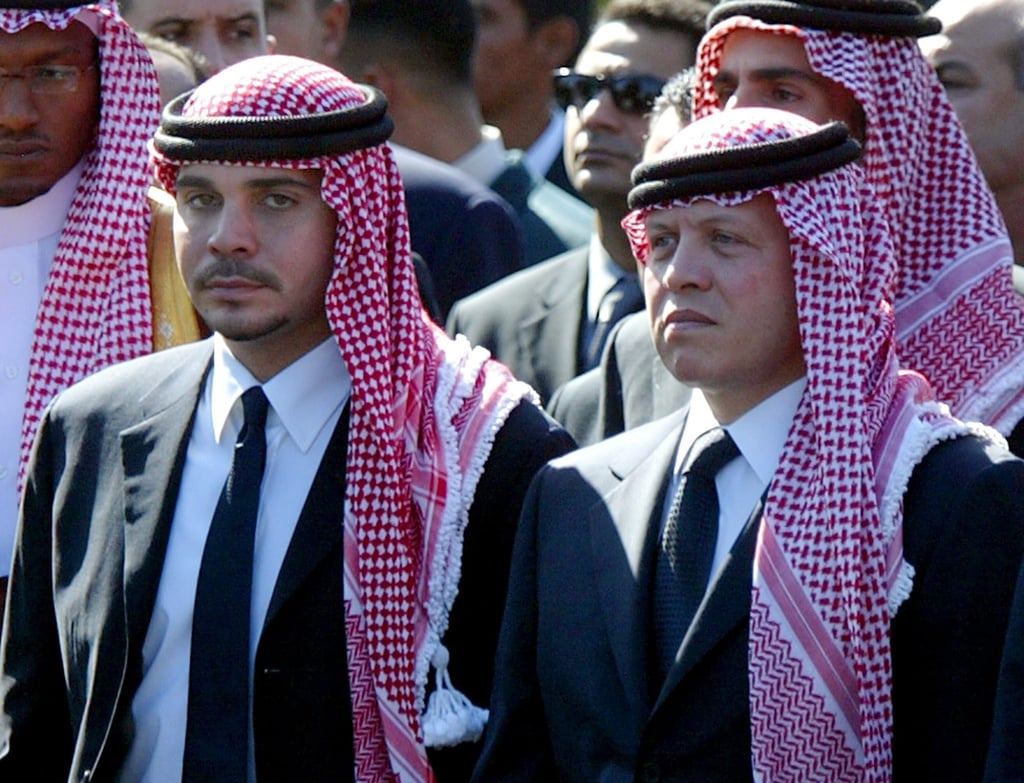 King Abdullah of Jordan (right) and his half-brother Prince Hamzeh walk together in the funeral procession of Palestinian President Yasser Arafat in Cairo, Egypt, in November 2004. Photo: EPA-EFE King Abdullah of Jordan (right) and his half-brother Prince Hamzeh walk together in the funeral procession of Palestinian President Yasser Arafat in Cairo, Egypt, in November 2004. Photo: EPA-EFE
