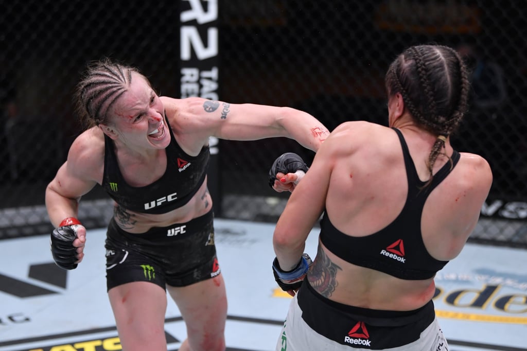 Valentina Shevchenko punches Jennifer Maiain their women’s flyweight championship bout at UFC 255. Photo: Jeff Bottari/Zuffa LLC