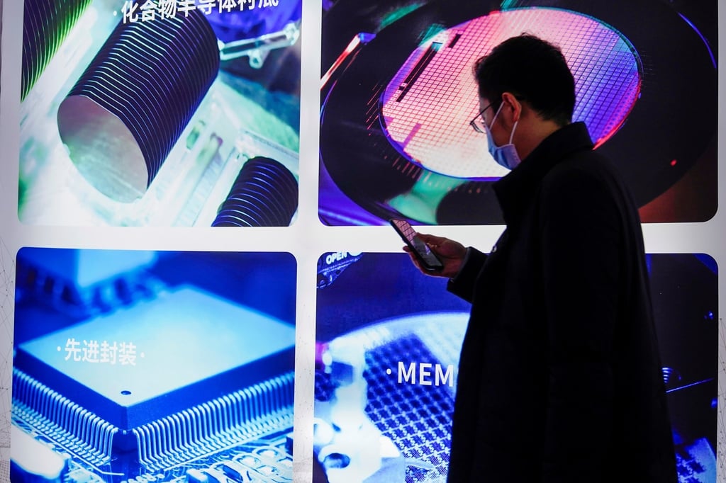 A man visits a display of semiconductor devices at Semicon China, a trade fair for integrated circuit technology, in Shanghai on March 17, 2021. Photo: Reuters