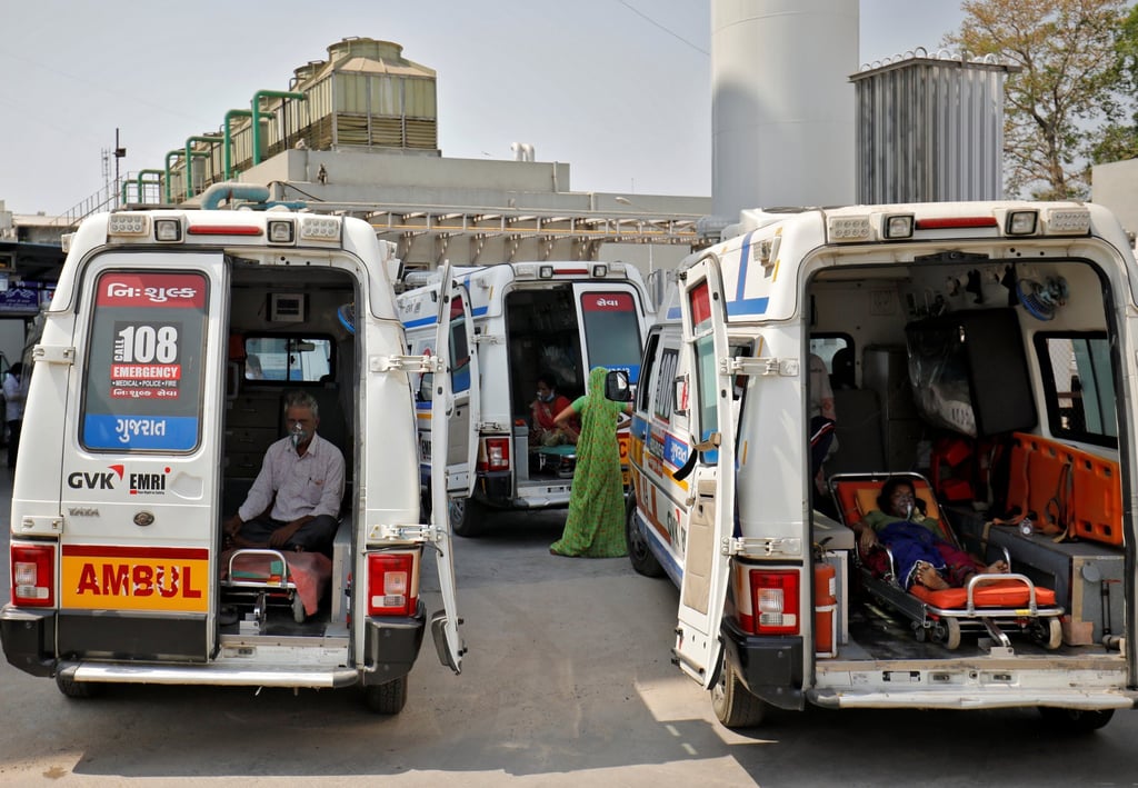 Patients wearing oxygen masks wait inside ambulances as they queue to enter a Covid-19 hospital in Ahmedabad on Wednesday. Photo: Reuters