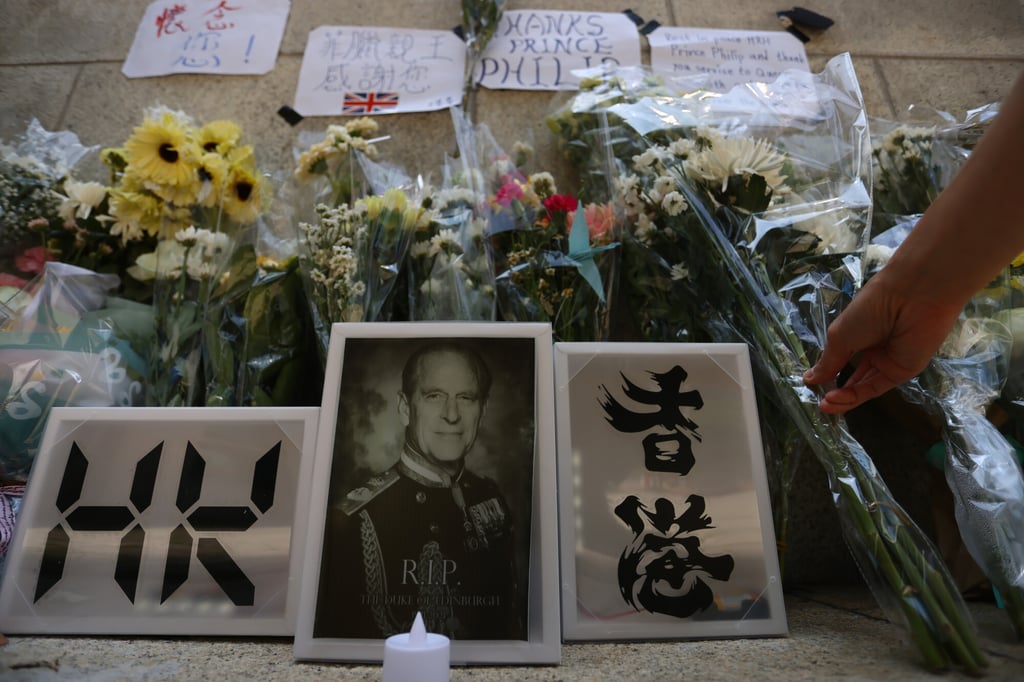 People leave flowers outside the British consulate in Admiralty, Hong Kong, on April 11 to mourn the death of Prince Philip. Photo: Nora Tam People leave flowers outside the British consulate in Admiralty, Hong Kong, on April 11 to mourn the death of Prince Philip. Photo: Nora Tam