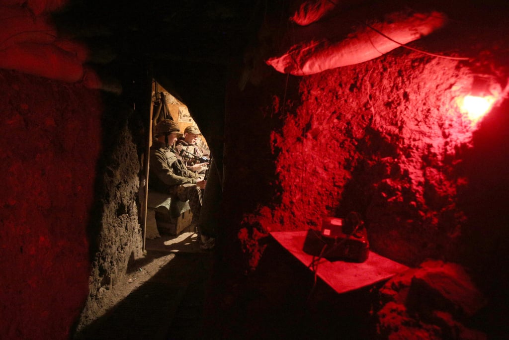 Ukrainian servicemen are seen inside a fortified position on the frontline with Russia backed separatists near small city of Marinka, Donetsk region, on Monday. Photo: AFP
