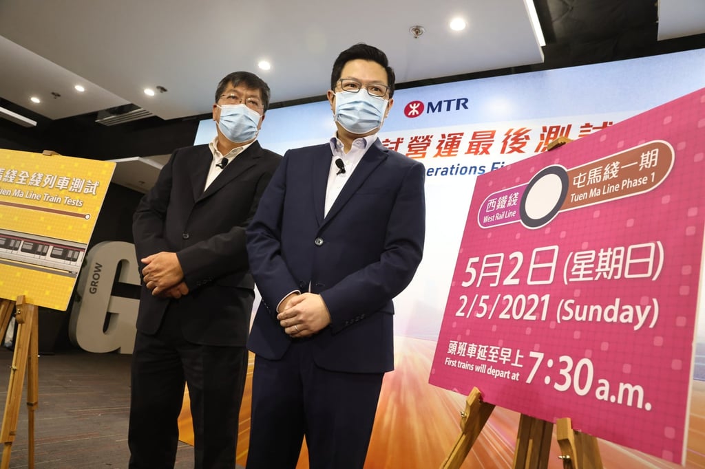 MTR Corp divisional general manager James Chow (left) and chief of operation Sammy Wong announce a test un on the full Tuen Ma line on Wednesday. Photo: K.Y. Cheng