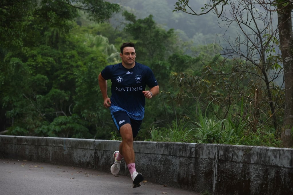 John McCormick-Houston runs up Magazine Gap in Mid-Levels as part of the ‘HKFC Rugby to Hanoi’ fundraising month. Photo: Dickson Lee