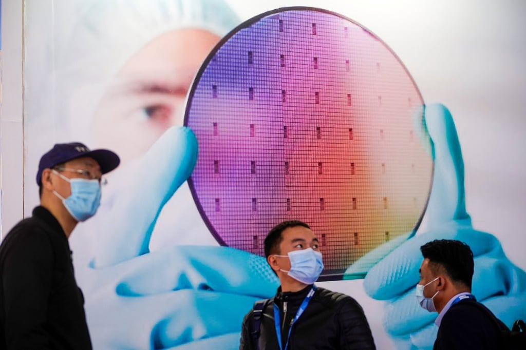 People visit a booth at SEMICON  China, a trade fair for semiconductor technology, in Shanghai, China March 17, 2021. Photo: Reuters
