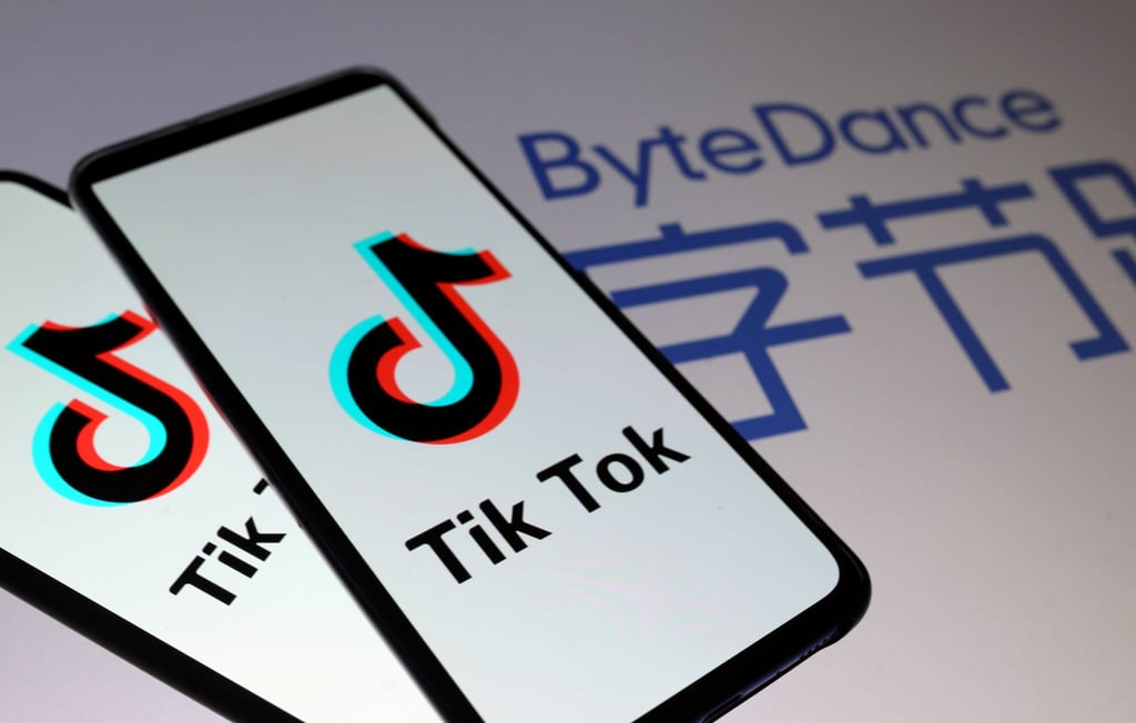 TikTok logos on smartphones in front of a ByteDance logo. Photo: Photo: Reuters