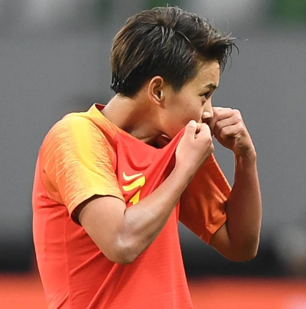 Wang celebrates scoring against South Korea in the Olympic qualifier on Tuesday. Photo: Xinhua