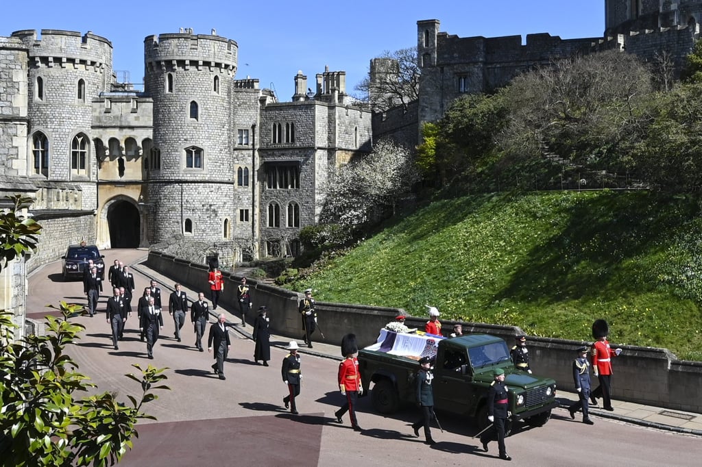 Members of Britain’s royal family follow Prince Philip’s coffin as it makes its way past the Round Tower at Windsor Castle on Saturday. Photo: AP